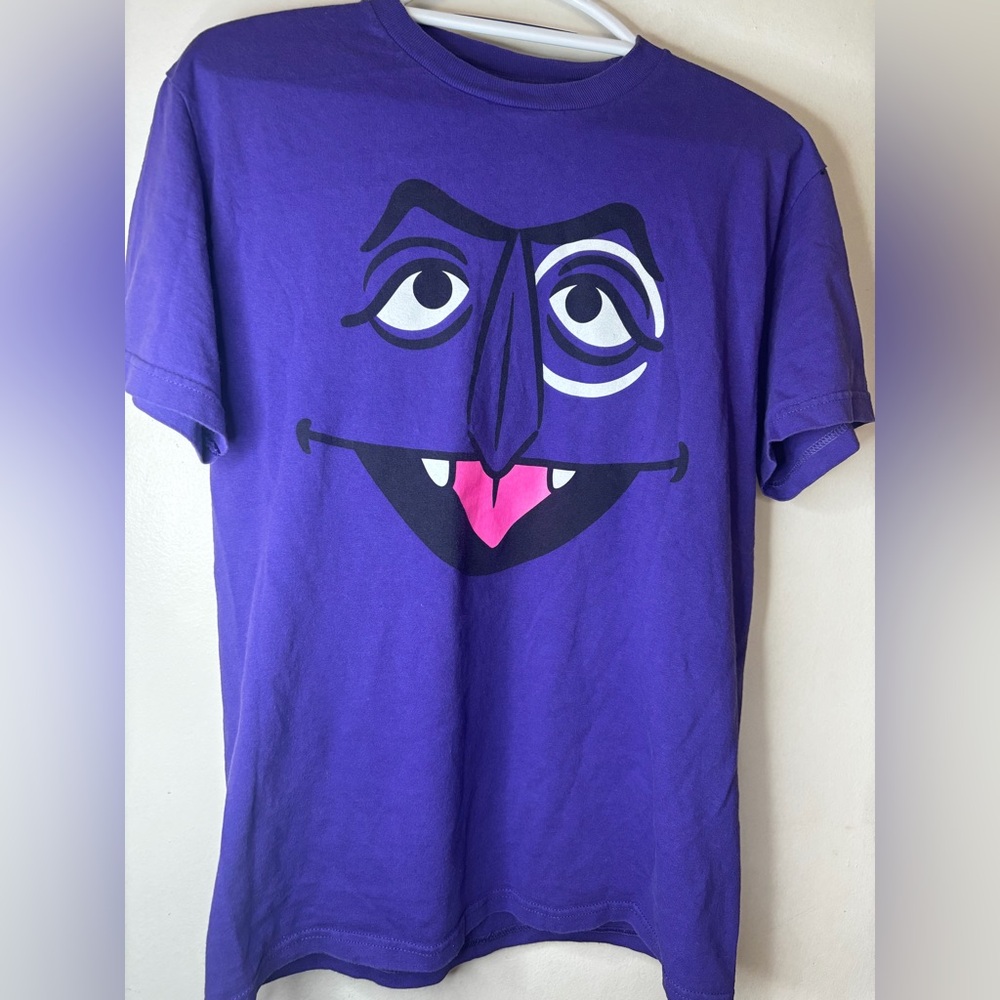 Purple Graphic Face T-Shirt – Fun Character Design
